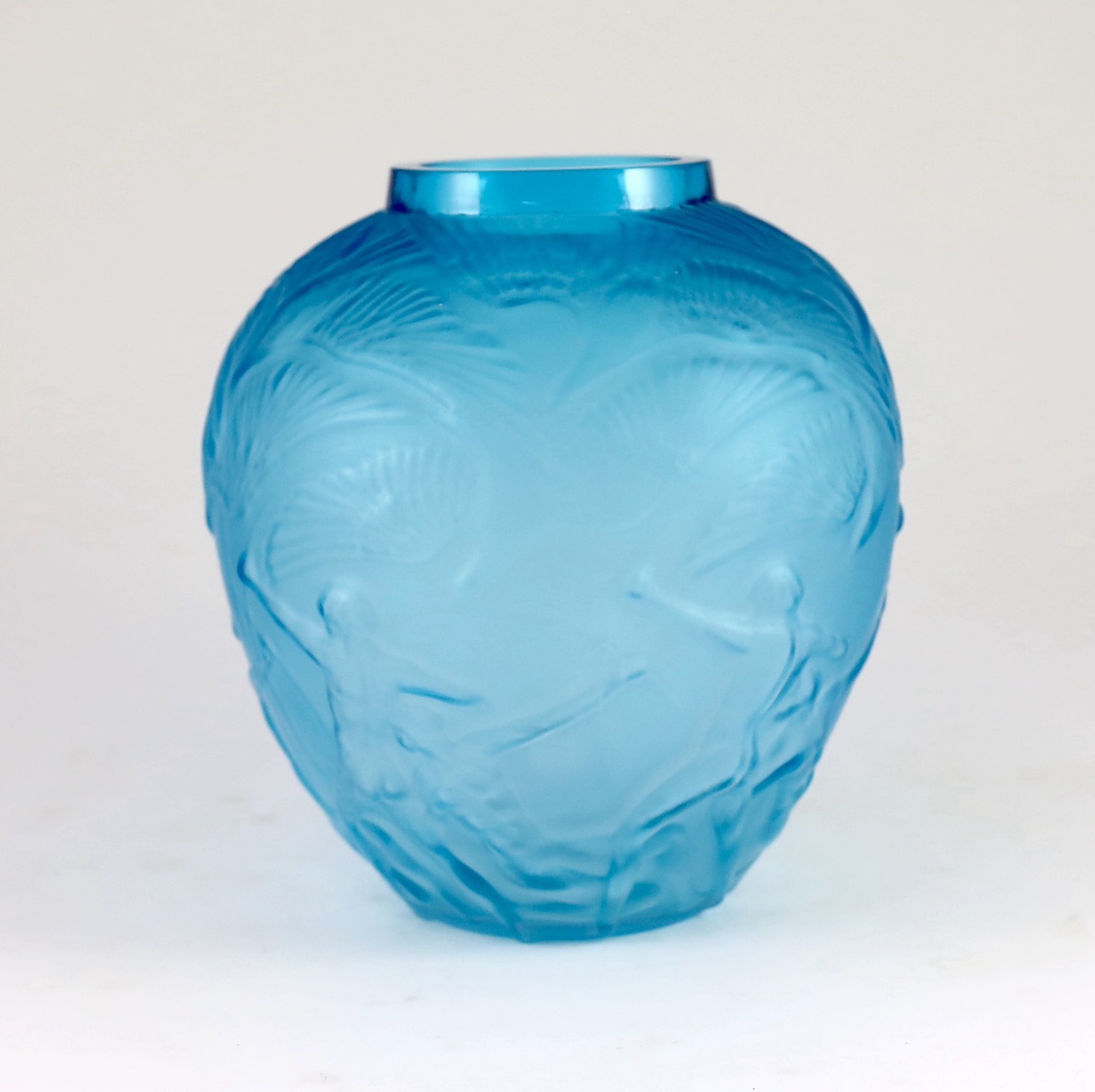 A Lalique style Archers pattern blue glass vase, 26cms high